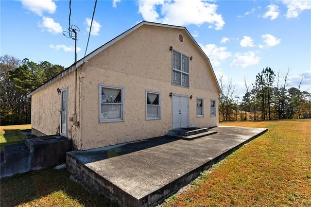 a backyard of a house with wooden floor