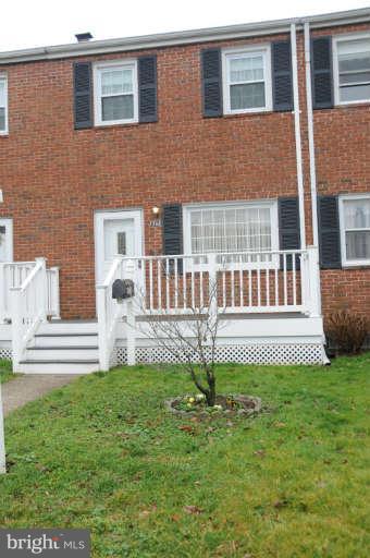 8173 Mid Haven Road Baltimore, MD 21222 - Photo 1 of 30 a front view of a house with a garden