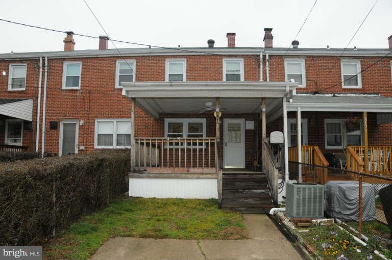 8173 Mid Haven Road Baltimore, MD 21222 - Photo 16 of 30 a view of a brick house with many windows