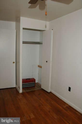 8173 Mid Haven Road Baltimore, MD 21222 - Photo 25 of 30 a view of room with stairs and wooden floor