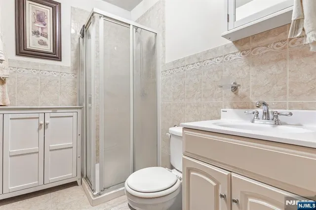 a bathroom with a sink toilet and vanity