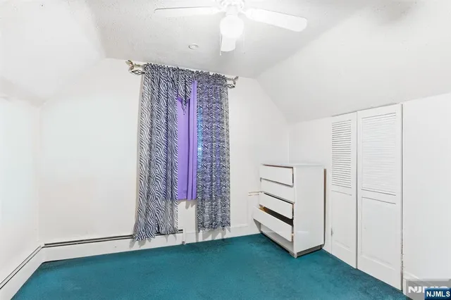 a view of a room with window and closet