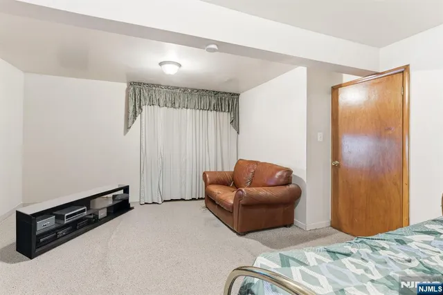 a bedroom with furniture and a air conditioner