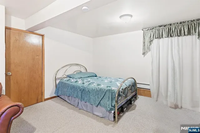 a bedroom with a bed and a table