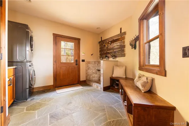 a view of a livingroom with furniture and windows