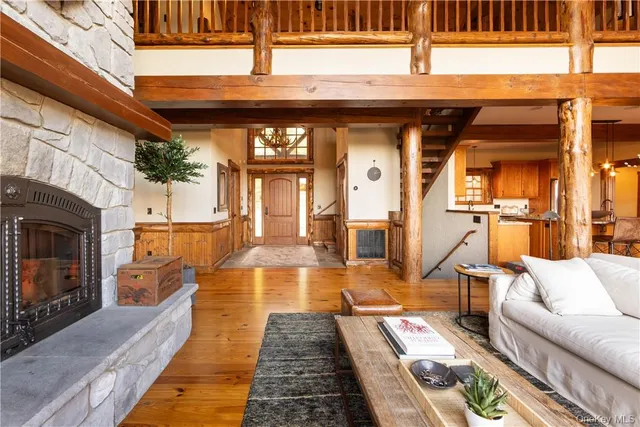 a view of a living room with a couch and wooden floor