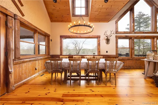 a view of a swimming pool with outdoor seating