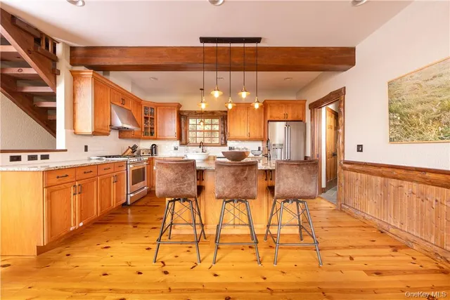 a view of kitchen with cabinets and wooden floor