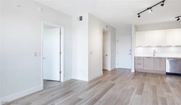 a view of a kitchen with wooden floor