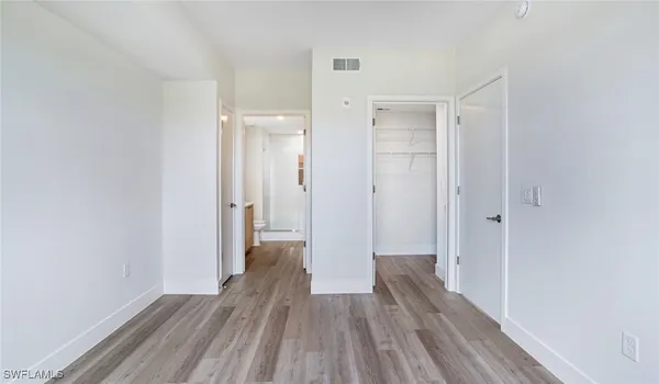 a view of hallway with wooden floor