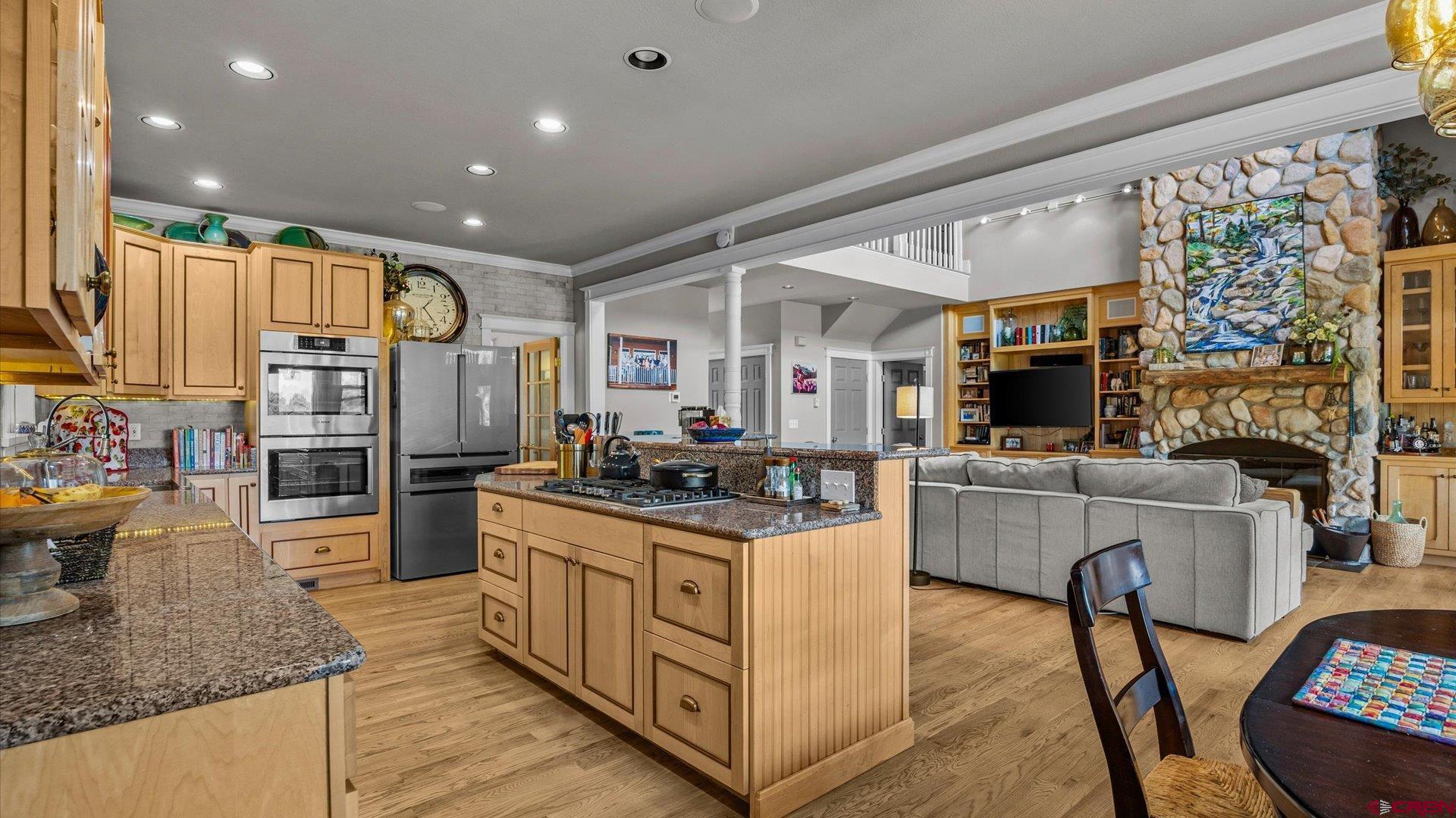 269 Puma Lane Ridgway, CO 81432 - Photo 16 of 36 a kitchen with stainless steel appliances granite countertop a stove oven and a refrigerator