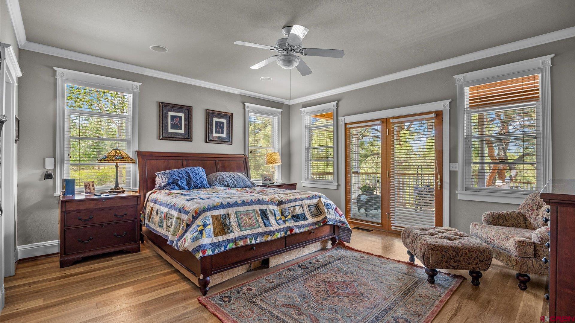 269 Puma Lane Ridgway, CO 81432 - Photo 20 of 36 a bed sitting in a bedroom next to a window