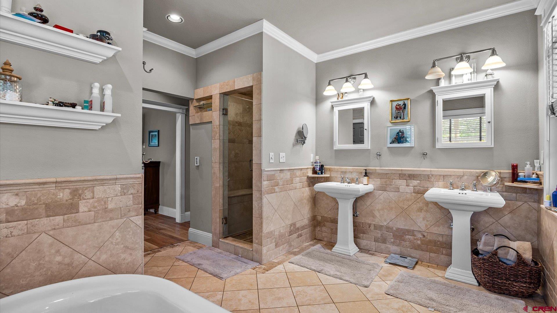 269 Puma Lane Ridgway, CO 81432 - Photo 22 of 36 a bathroom with a sink mirror and a shower