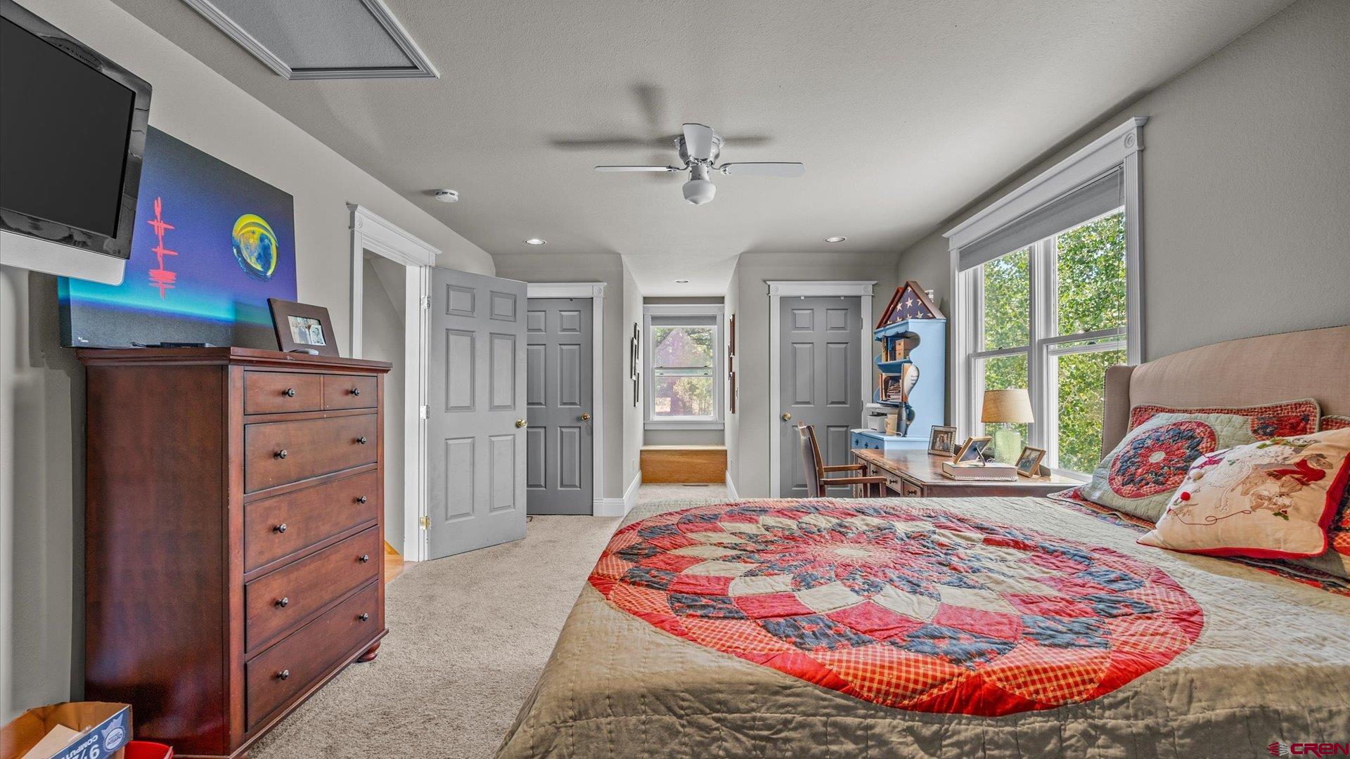 269 Puma Lane Ridgway, CO 81432 - Photo 28 of 36 a bedroom with a bed and a flat screen tv