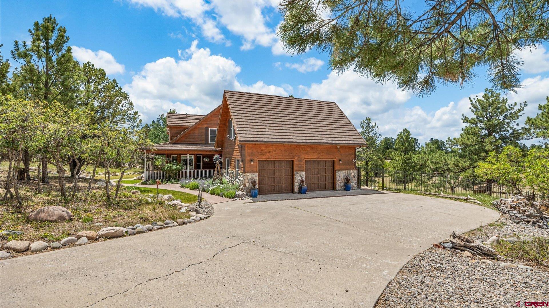 269 Puma Lane Ridgway, CO 81432 - Photo 4 of 36 a front view of a house with a garden