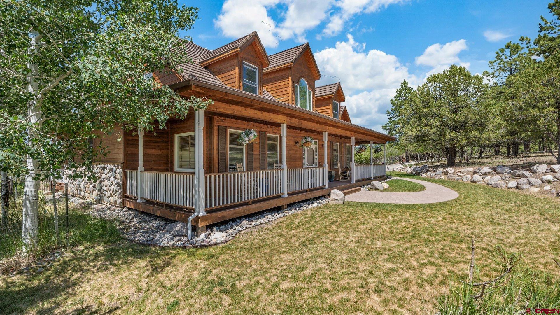 269 Puma Lane Ridgway, CO 81432 - Photo 5 of 36 a view of a house with backyard and sitting area