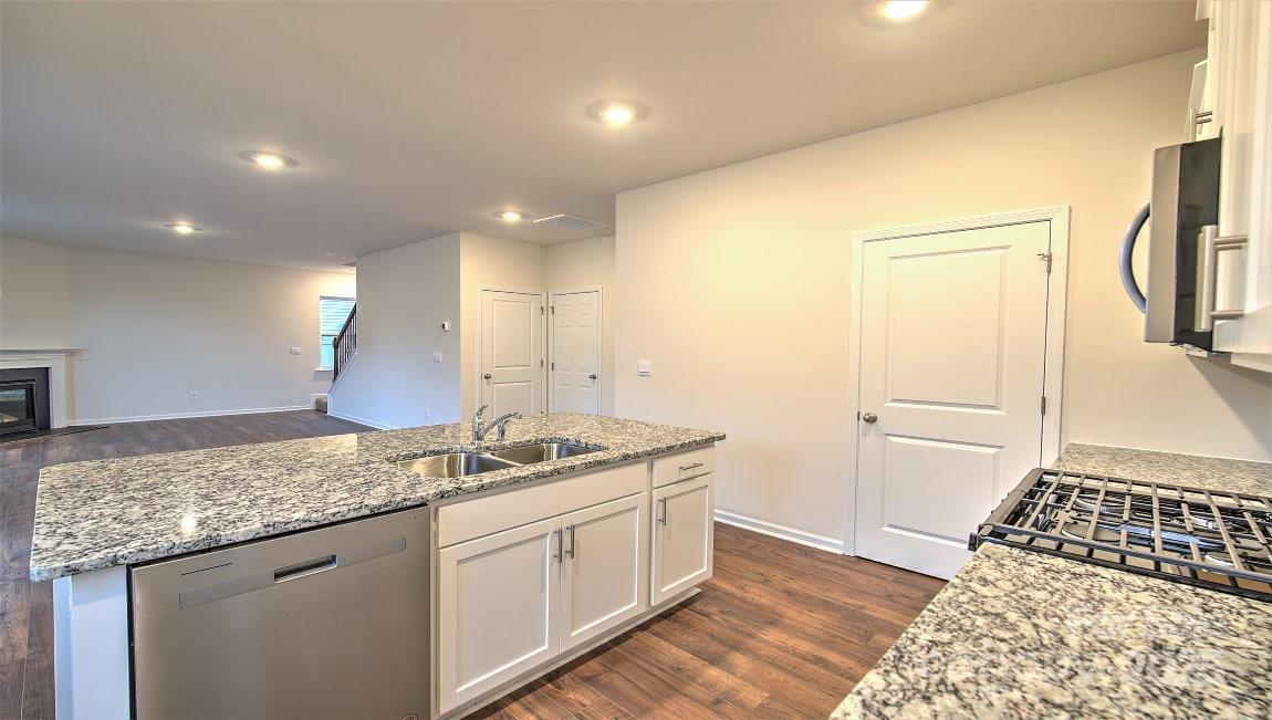 356 Wheatfield Road Fletcher, NC 28732 - Photo 6 of 25 a bathroom with a granite countertop sink and a mirror