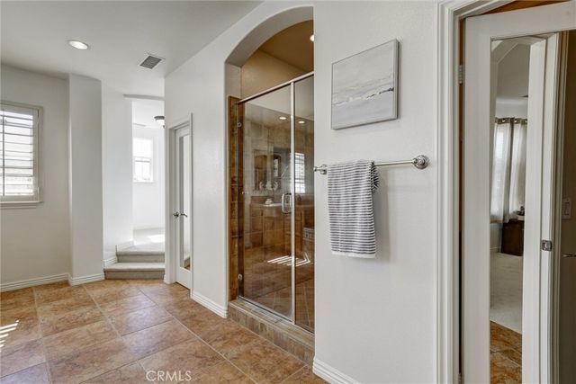 a view of a bathroom with a glass door and shower