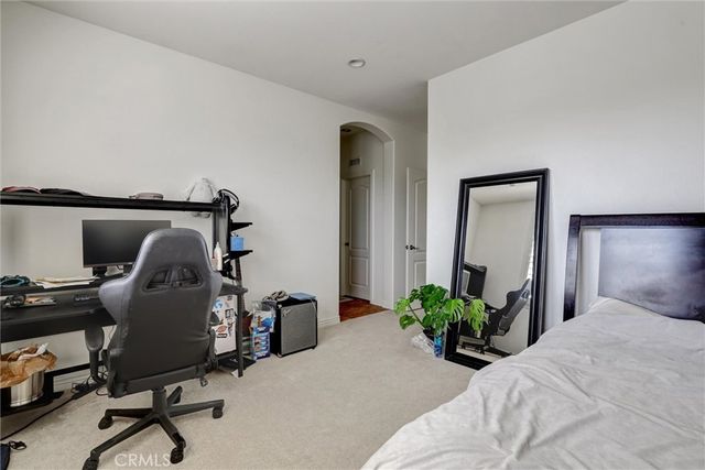 a view of a workspace with furniture and a potted plant