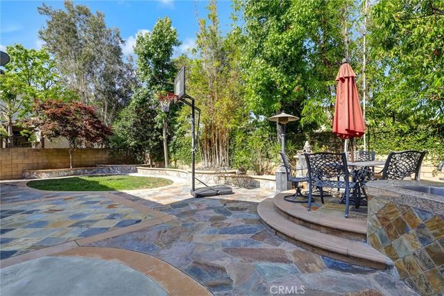 swimming pool with outdoor seating and yard