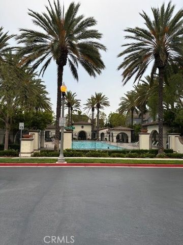 a house with palm trees in front of it
