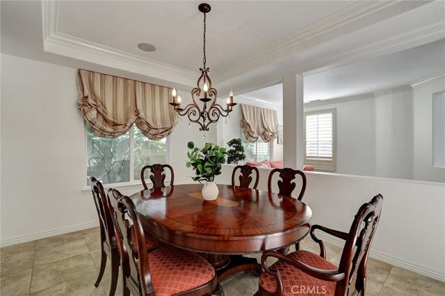 a view of a dining room that has a table and chairs