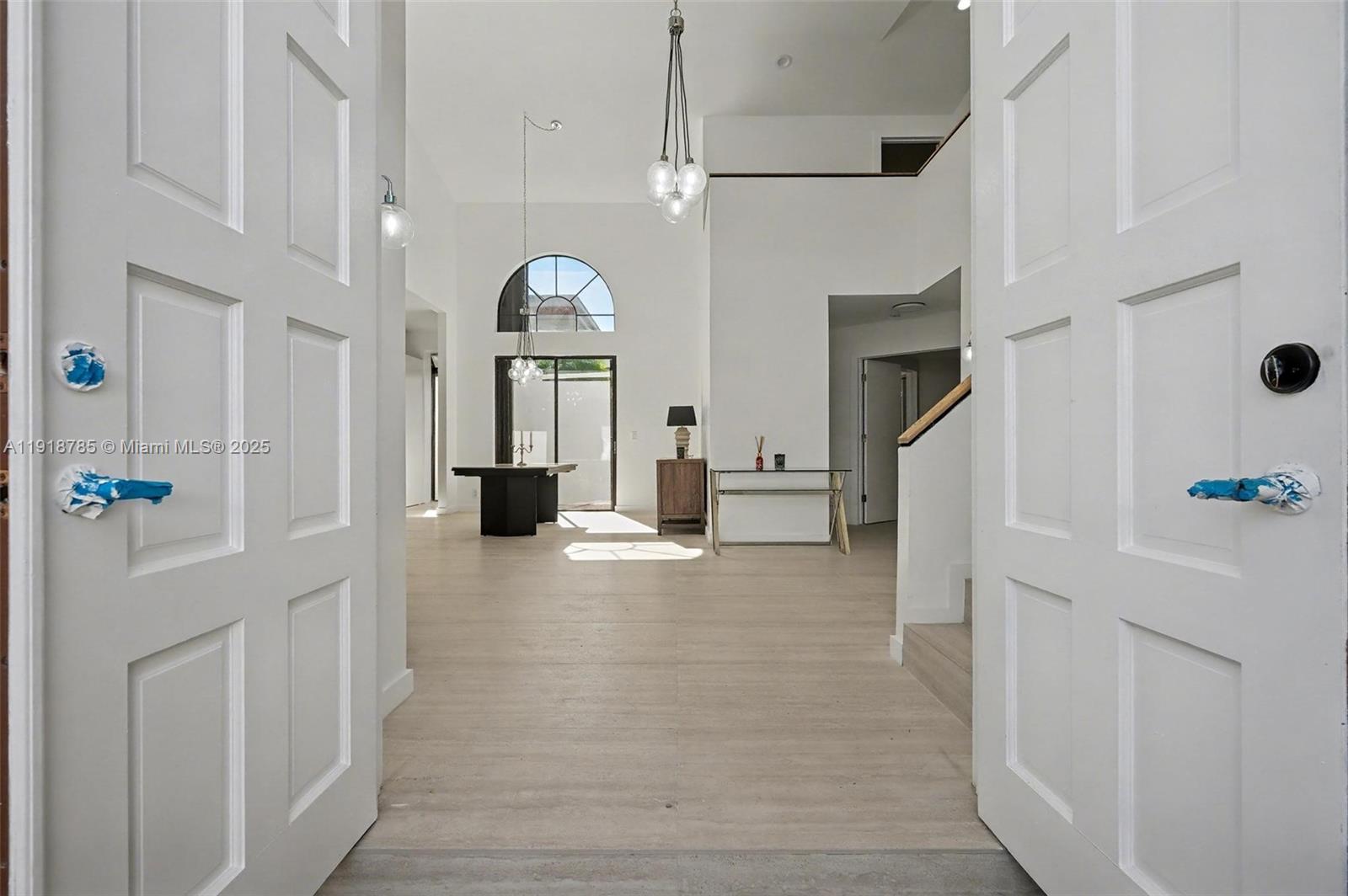 6438 Via Rosa Boca Raton, FL 33433 - Photo 18 of 45 a view of a hallway with entryway window and livingroom view