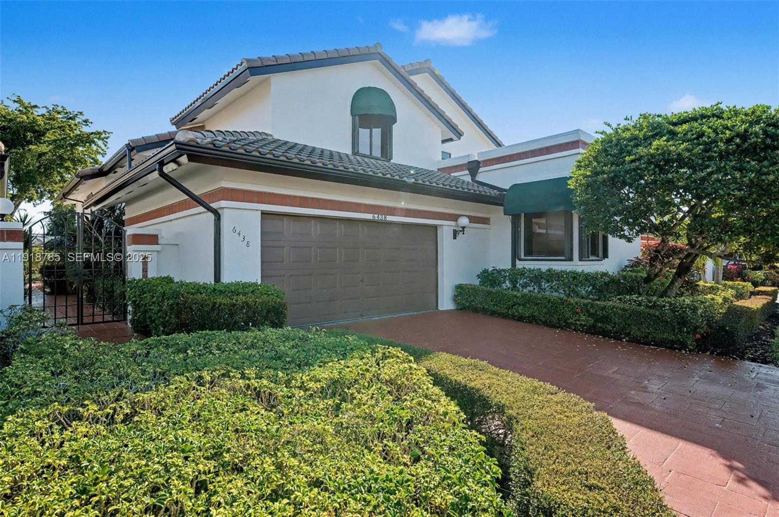 6438 Via Rosa Boca Raton, FL 33433 - Photo 2 of 45 a view of a house with a small yard
