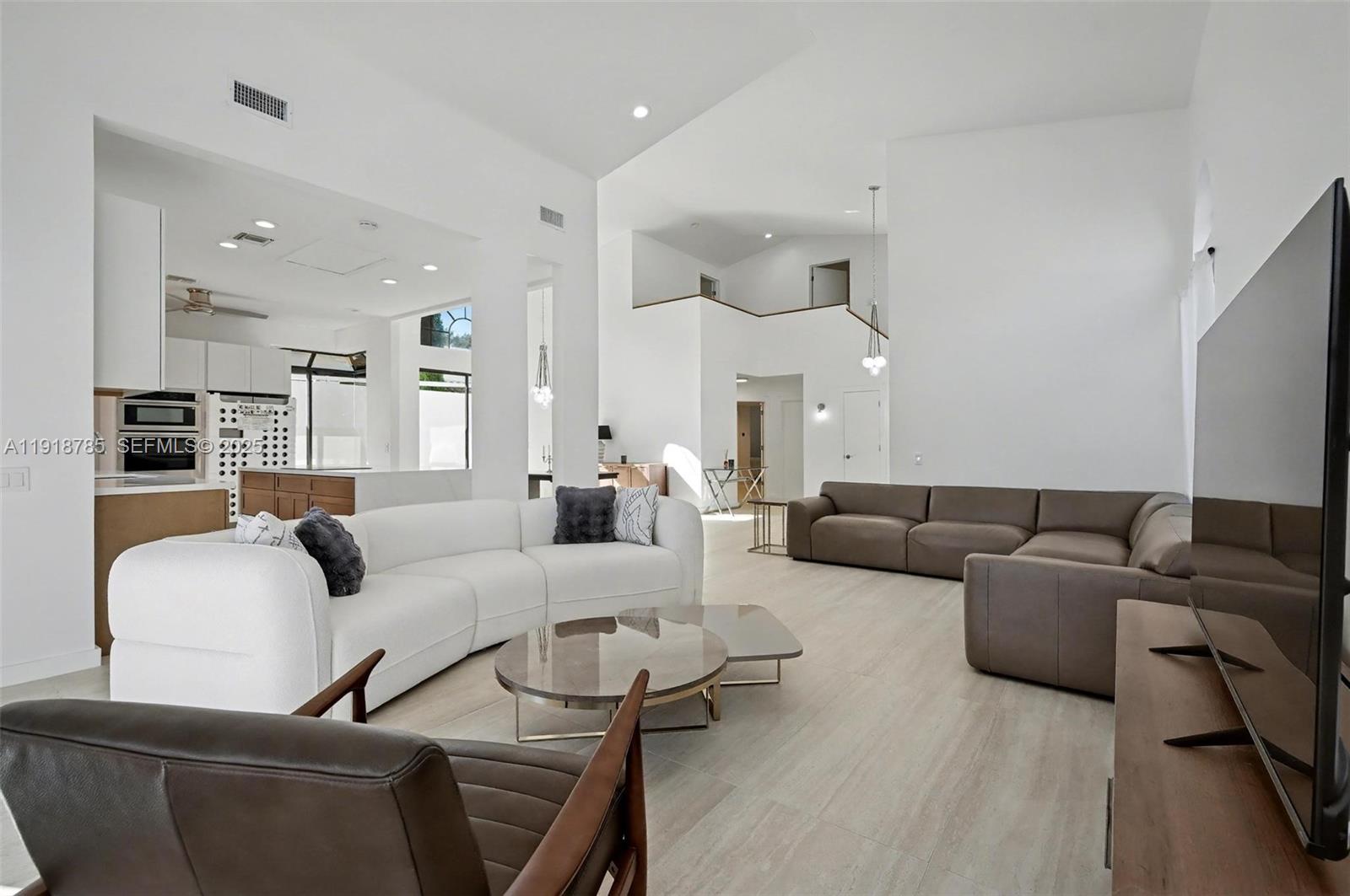 6438 Via Rosa Boca Raton, FL 33433 - Photo 25 of 45 a living room with furniture and a wooden floor