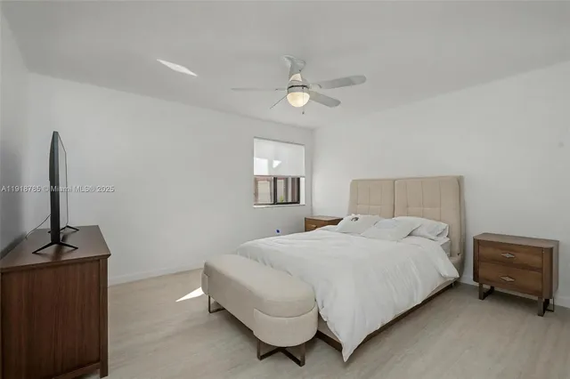 a bathroom with a double vanity sink mirror and shower