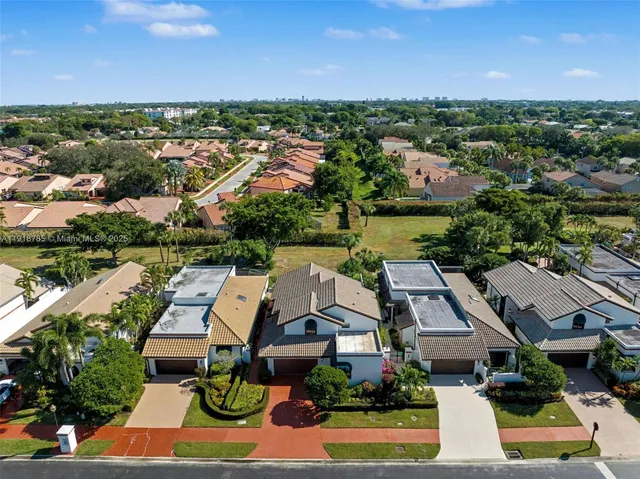 an aerial view of house with yard swimming pool and outdoor seating