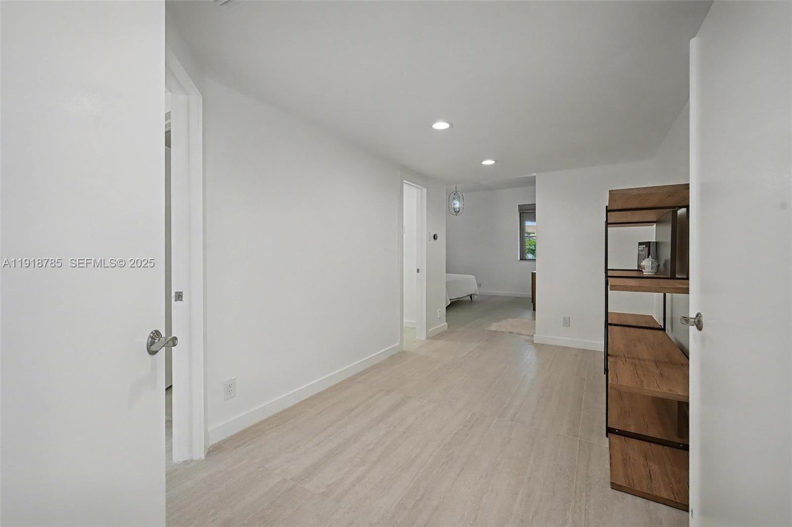 6438 Via Rosa Boca Raton, FL 33433 - Photo 32 of 45 a view of a hallway with a room