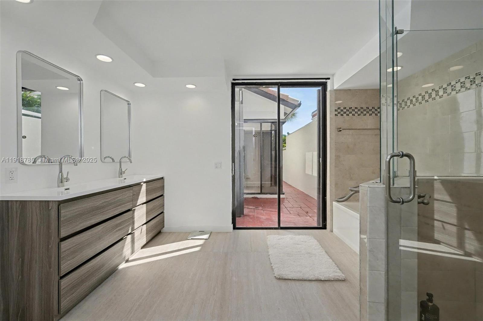 6438 Via Rosa Boca Raton, FL 33433 - Photo 37 of 45 a bathroom with a sink a vanity and shower