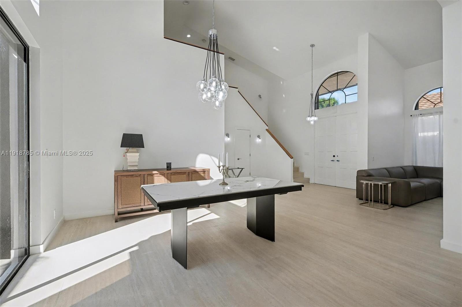 6438 Via Rosa Boca Raton, FL 33433 - Photo 41 of 45 a room with furniture and a chandelier