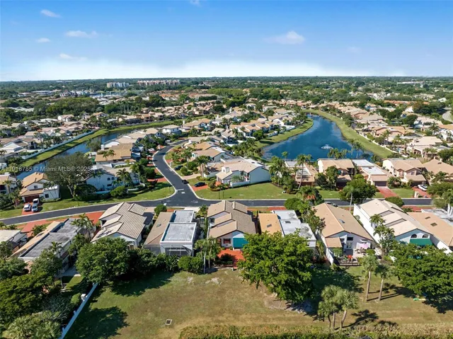 an aerial view of residential houses with outdoor space