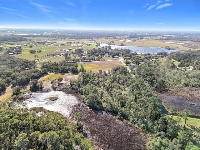 a view of a road with mountains in the background