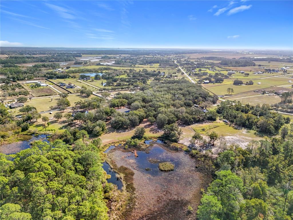 Pine Island Road Clermont, FL 34711 - Photo 8 of 18 an aerial view of residential houses with outdoor space