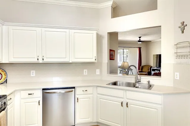 a kitchen with appliances cabinets and a sink