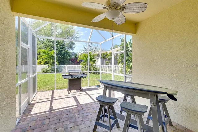 a view of a porch with chairs and backyard
