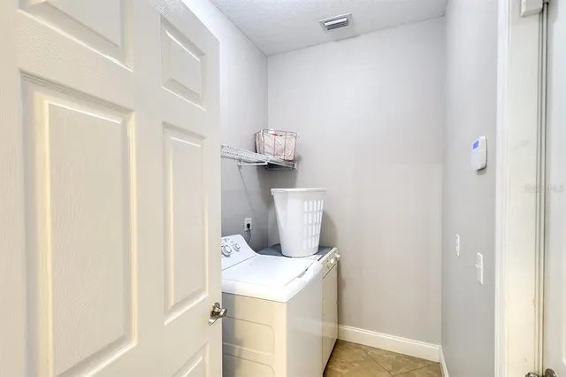 a room with a stove and a wooden floor