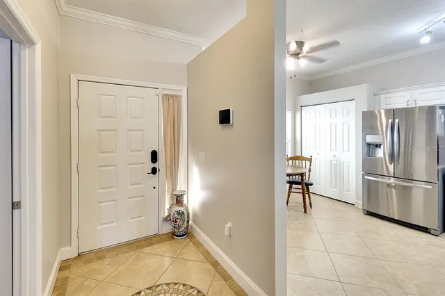 a view of a kitchen with a refrigerator and a sink