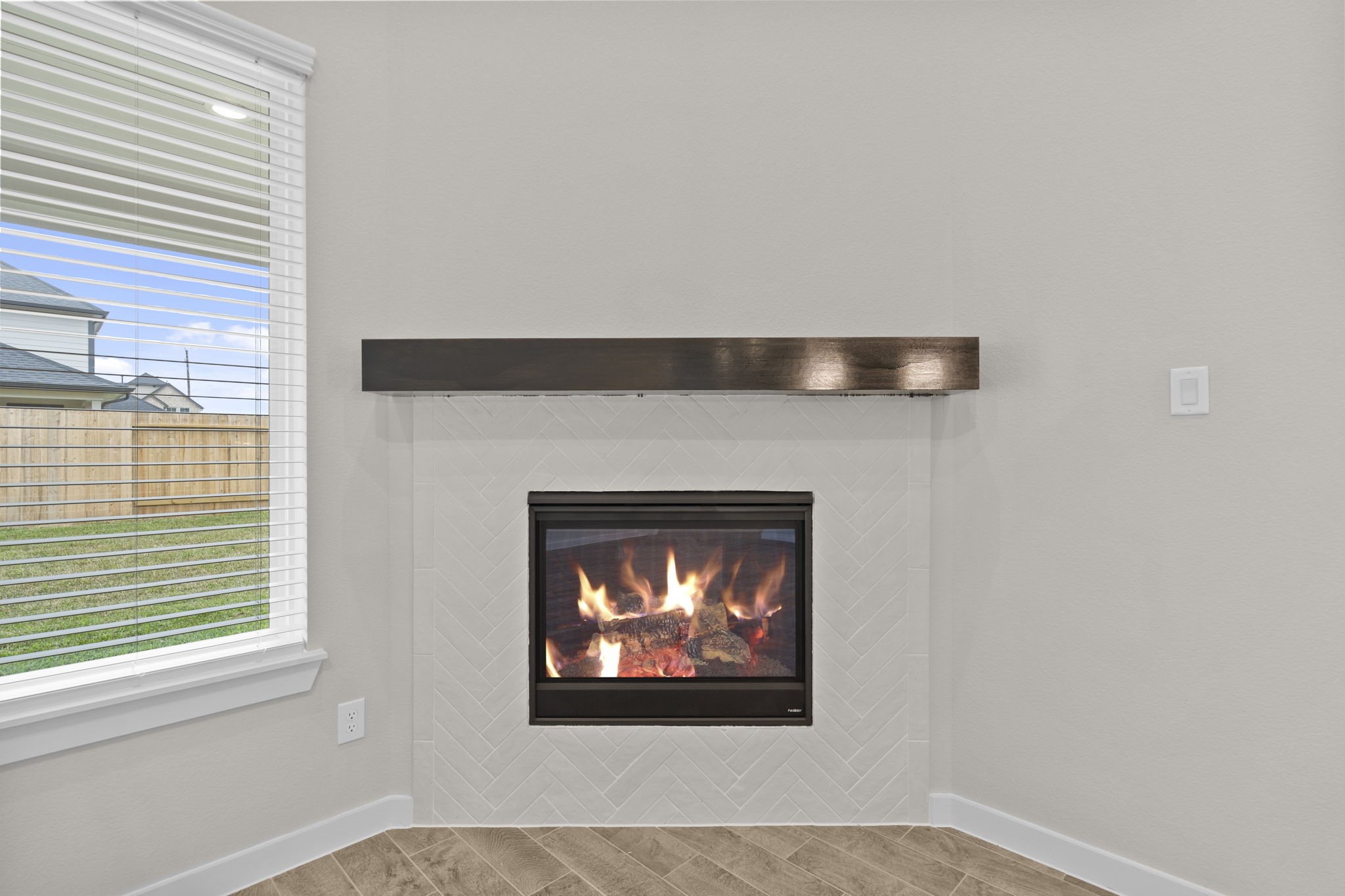 3034 Spitfire Drive Rosenberg, TX 77471 - Photo 14 of 47 a living room with a fireplace and a window