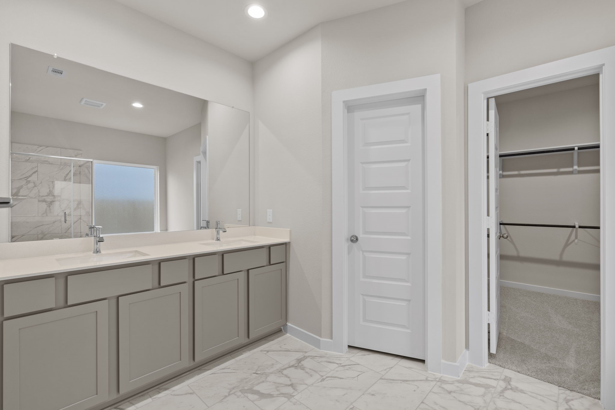 3034 Spitfire Drive Rosenberg, TX 77471 - Photo 18 of 47 a bathroom with a double vanity sink and a mirror