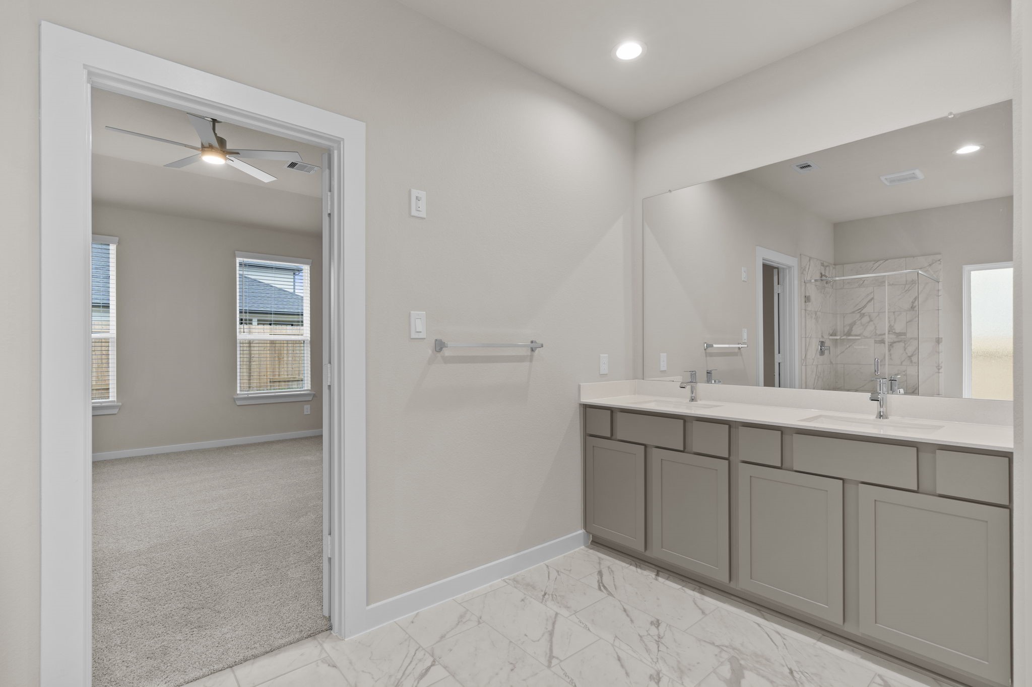 3034 Spitfire Drive Rosenberg, TX 77471 - Photo 19 of 47 a spacious bathroom with a double vanity sink mirror and