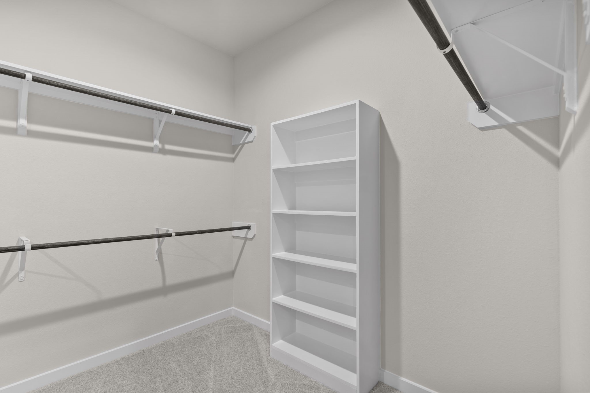 3034 Spitfire Drive Rosenberg, TX 77471 - Photo 20 of 47 a view of walk in closet with empty racks