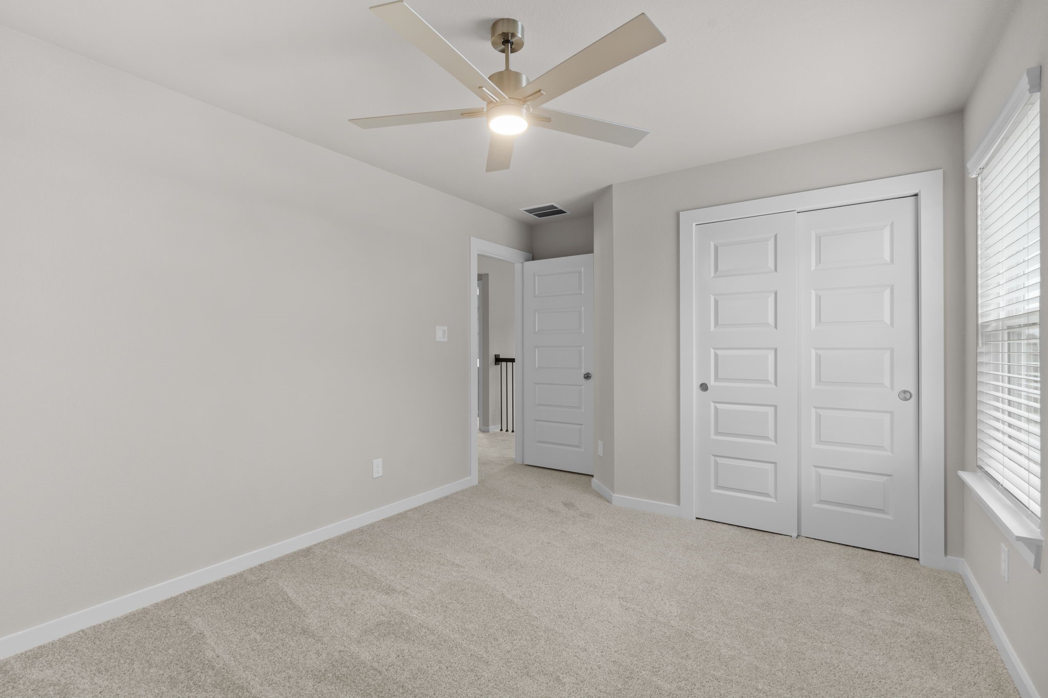 3034 Spitfire Drive Rosenberg, TX 77471 - Photo 27 of 47 an empty room with closet and a ceiling fan