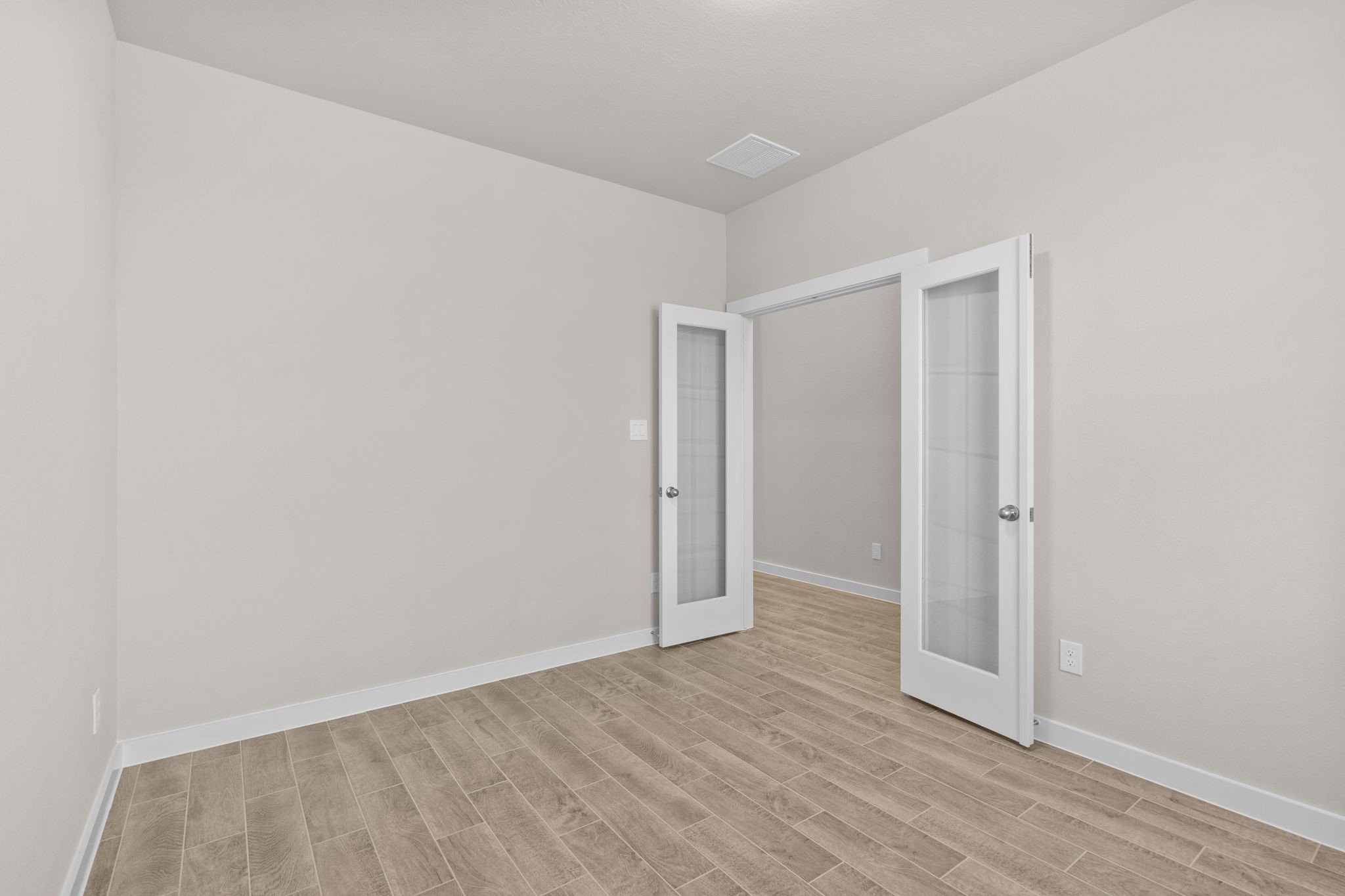 3034 Spitfire Drive Rosenberg, TX 77471 - Photo 8 of 47 a view of an empty room with wooden floor