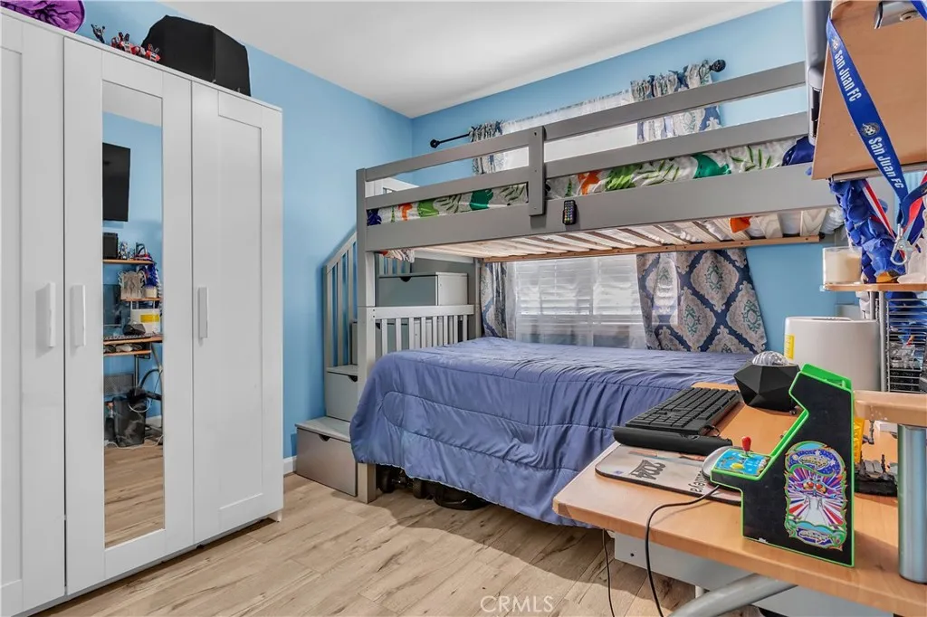 3738 Ahern Drive Baldwin Park, CA 91706 - Photo 12 of 36 a bedroom with a bed and a wooden floor