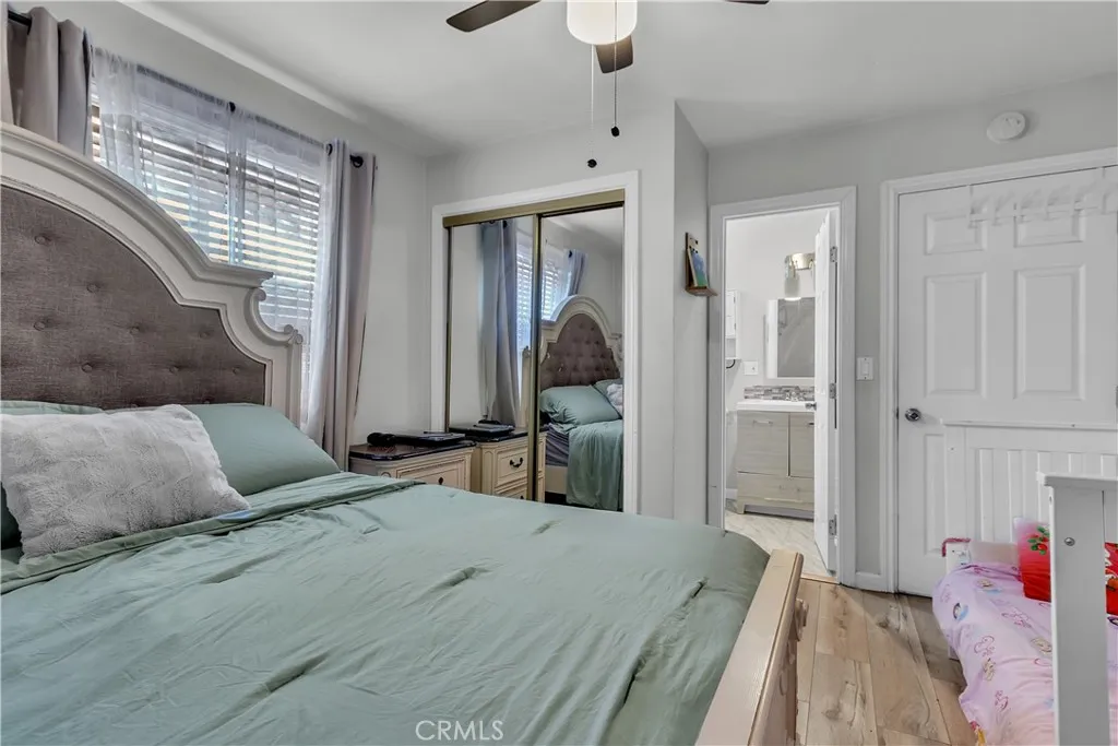 3738 Ahern Drive Baldwin Park, CA 91706 - Photo 15 of 36 a bedroom with a bed and a chandelier