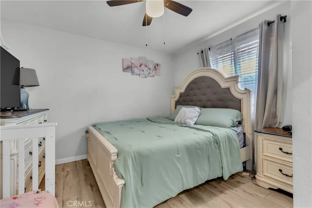 3738 Ahern Drive Baldwin Park, CA 91706 - Photo 16 of 36 a bedroom with a bed and a flat tv screen on the dresser
